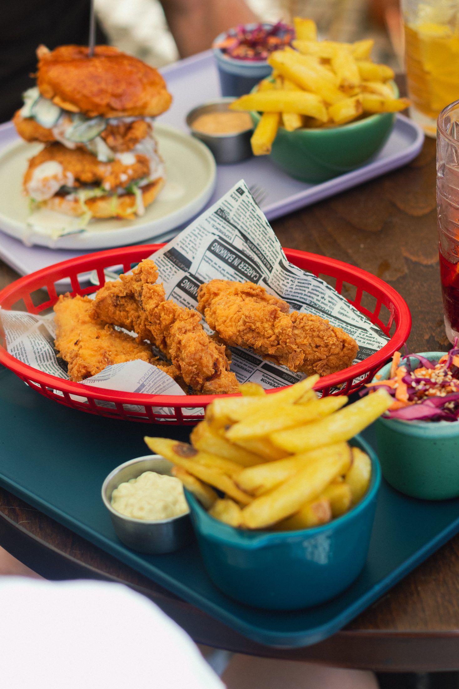 Hand-breaded crispy fried chicken tenders with fries at Cheat Day in Ericeira